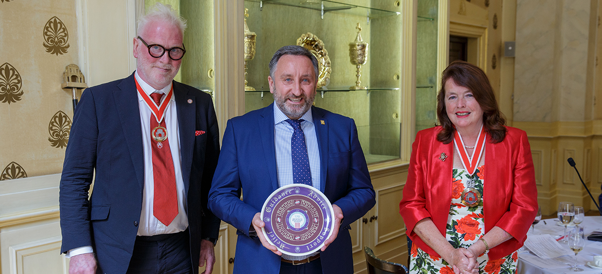 Eddie-Weir-Receives-WCCA-Award-Plate-Designed-by-Jane-Duncan
